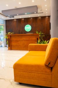 a lobby with a couch in front of a cash counter at Supreme Dambulla in Dambulla +48 photos