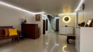 a large living room with a couch and a table at Le Tanjong House in Patong Beach