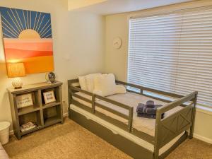 a childs bedroom with a bunk bed with a window at Sun Dazed Tempe with Cali Soul Vibe in Tempe