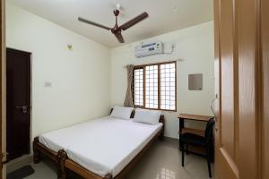 Ένα ή περισσότερα κρεβάτια σε δωμάτιο στο Golden Beach Home Stay