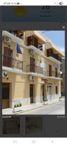 a screenshot of a picture of a building at Kabanis Rooms in Ermoupoli