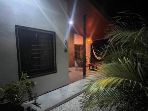 a house with a window and some plants at Apartamento 1, cerca de la playa, naturaleza y paz in Santa Cruz +37 photos