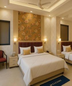 a bedroom with a large bed with a painting on the wall at KANHA RETREAT - Vrindavan in Vrindāvan