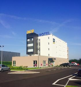 a hotel with a ac hotel sign on top of it at Ace Hotel Creutzwald Saint Avold in Creutzwald-la-Croix