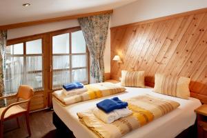 Postel nebo postele na pokoji v ubytování Sporthotel Kogler + 37 fotografií