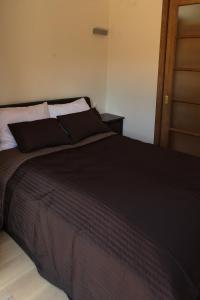 Кровать или кровати в номере Holiday Terrace Nida