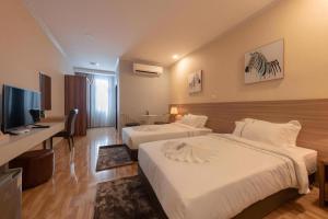 TV a/nebo společenská místnost v ubytování One Vientiane Hotel + 59 fotografií