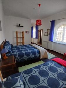 Ένα ή περισσότερα κρεβάτια σε δωμάτιο στο Casa da Tauria