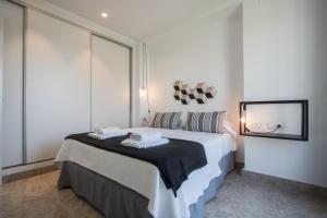 Postel nebo postele na pokoji v ubytování Apartamentos Marina Playa