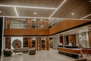 a lobby of a store with couches and a bar at BANMALI PALACE in Kantābānji +76 photos