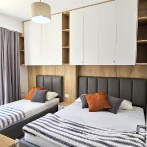 Ένα ή περισσότερα κρεβάτια σε δωμάτιο στο Cosy Sea View Apartment