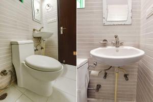 a bathroom with a toilet and a sink at Hotel Shiva in Jaipur