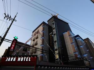 a tall building with christmas lights on it at Java Hotel in Daejeon