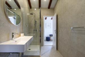 a bathroom with a sink and a shower and a mirror at KALETA HOUSE by DuHomes in Dubrovnik +84 photos