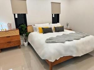 Postel nebo postele na pokoji v ubytování บ้านออนคลาวด์