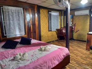 Postel nebo postele na pokoji v ubytování Jidapa Resort