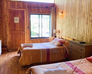 Postelja oz. postelje v sobi nastanitve Hostal Chumay