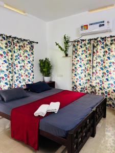 Katil atau katil-katil dalam bilik di Villa Luna Varkala