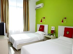 Ένα ή περισσότερα κρεβάτια σε δωμάτιο στο Super 8 Hotel Guangzhou Huanghuagang Branch +177 φωτογραφίες