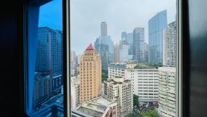 a view of a city skyline from a window at The house where time is wasted under the road in Chongqing