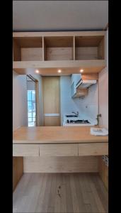 a kitchen with a large wooden counter top at Hongdae Sinchon Skyview in Seoul