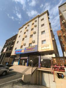 a building on the corner of a street at Qasr Aljoud Serviced Apartments in Abha +28 photos