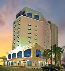 a building with a car parked in front of it at Taj Celine Hotel in Jeddah