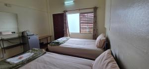 Postel nebo postele na pokoji v ubytování P.L.P Guesthouse - Mae Hong Son