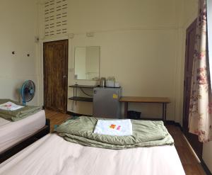 Postel nebo postele na pokoji v ubytování P.L.P Guesthouse - Mae Hong Son