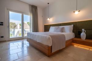 Postel nebo postele na pokoji v ubytování Essenza Relais Contemporaneo