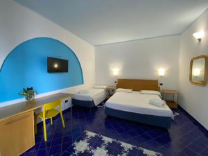Letto o letti in una camera di Hotel Aura