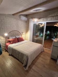Ένα ή περισσότερα κρεβάτια σε δωμάτιο στο Petit paradis