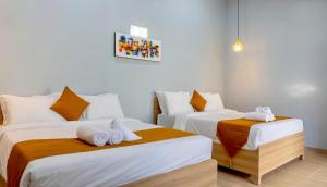 a room with two beds with towels on them at Kotoa Villa 68 in Nusa Dua +37 photos