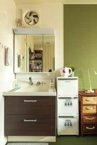 a bathroom with a sink and a stove at The Ivy Apartments, BEST Location, Yoyogi!! in Tokyo +111 photos