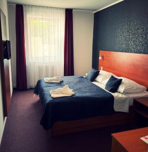 Voodi või voodid majutusasutuse Hotel ELMA toas