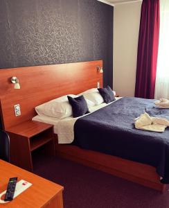 Voodi või voodid majutusasutuse Hotel ELMA toas