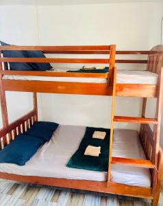 a couple of bunk beds in a room at Cockatoo Room Rentals Siquijor in Siquijor