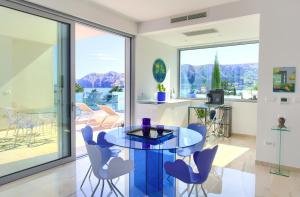 a living room with a glass table and chairs at The Oscar in Baška