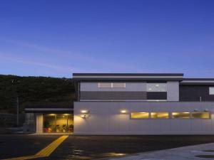a building with lights on the side of it at Daemado Hotel Hitakatsu in Kamitsushima