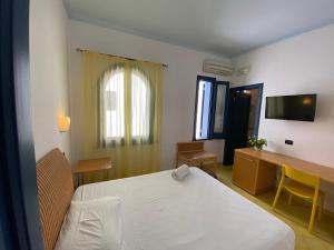Letto o letti in una camera di Hotel Aura