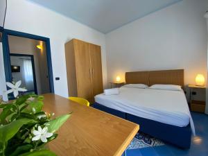 Letto o letti in una camera di Hotel Aura
