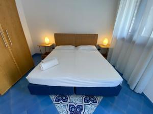 Letto o letti in una camera di Hotel Aura