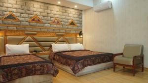 Park Hotel Gilgit客房内的一张或多张床位