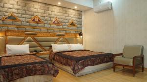 Park Hotel Gilgit客房内的一张或多张床位