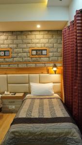 Park Hotel Gilgit客房内的一张或多张床位