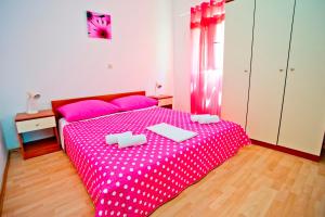 Postel nebo postele na pokoji v ubytování Apartments Alać