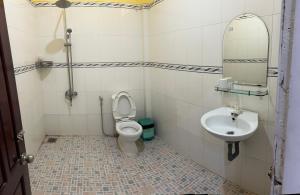 a bathroom with a toilet and a sink at Bungalow COCO CHILL PQ in Phú Quốc +23 photos