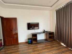 TV a/nebo společenská místnost v ubytování Jyothis Homestay Munnar + 40 fotografií