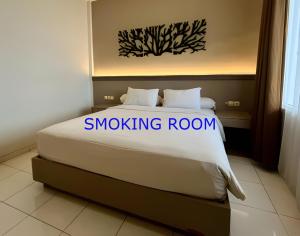 Postel nebo postele na pokoji v ubytování Front One Resort Indraloka Temanggung