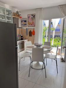 a kitchen with a table and chairs in a kitchen at Villa Mandarin in Opuzen